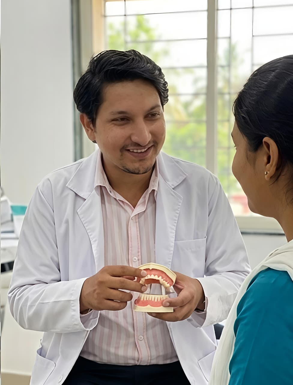 Dr. Atul Kumar providing dental treatment at Lakshmi Oral & Dental Care